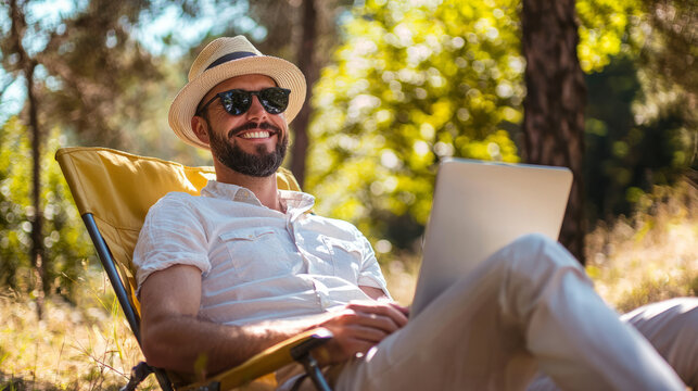 Relaxed businessman enjoying a break with laptop in nature
