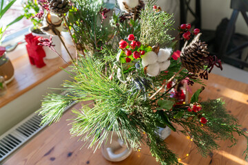 A luxurious and beautiful winter bouquet. Featuring seasonal flowers, it makes a perfect gift and decoration. Includes fir branches, ilex, nobilis, leucadendron, eucalyptus, and cotton.