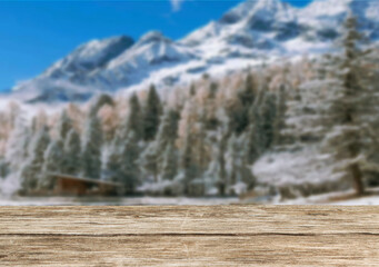 Wooden table top on blurred background mountains and forest nature Snow for important product editing or image layout design. View of the copy space.