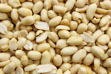 Pile of peeled peanut, group of nuts. Food ingredients. Top view