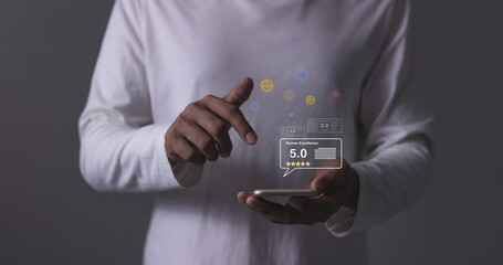 Review Excellence, Young Man hand holding Smart Phone with five star to review and give 5 stars with very good results in service, Good review 5 star rating choice feedback