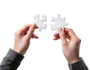 Hands holding two puzzle pieces, symbolizing connection and problem-solving.