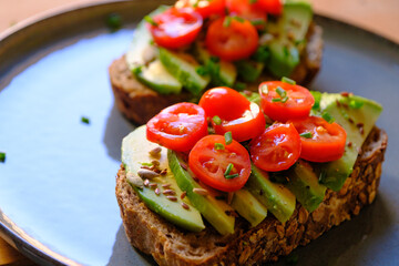 Vegan Avocado Toast with Cherry Tomatoes and Seeds - Healthy Breakfast