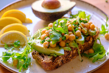 Vegan Avocado Toast with Chickpeas, Arugula, and Seeds - Healthy Breakfast