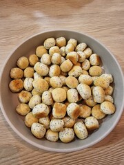 A bowl of Kūčiukai (Lithuanian traditional Christmas Eve biscuits with poppy seeds). Christmas culinary heritage. Close-up 