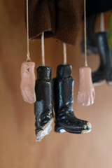 Old puppet figure in detail on a broken shoe.

