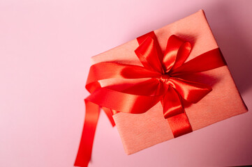 Valentine's day gift. Banner design with present box and hearts on pink background