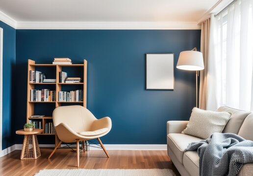 Beige armchair near sofa. Book shelf and floor lamp against blue wall. Scandinavian home interior design of modern living room 