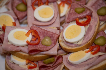 Bread rolls with egg and salami.
