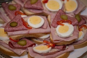 Bread rolls with egg and salami.
