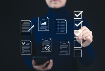 Quality Assurance and Document Control with Checklist Icons. A person marks off items on digital...