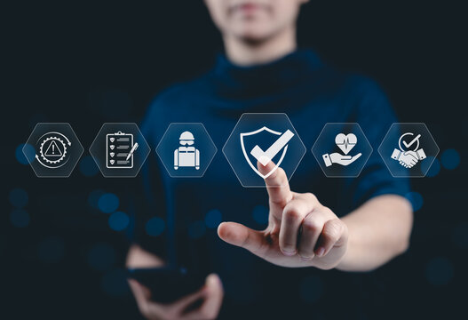 Work safety and compliance concept. A person with work safety and compliance icons, including a shield, hard hat, checklist, workplace safety, health protocols, and regulatory compliance. Safety First