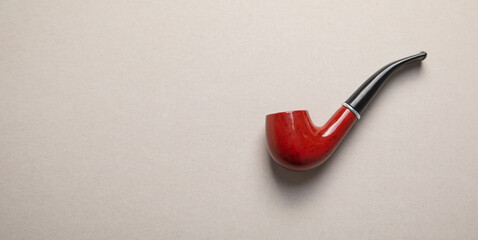 Elegant wooden smoking pipe. Bad addiction