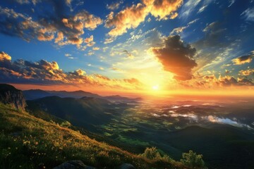 Fototapeta premium Majestic sunset over a serene valley with mountains and vibrant clouds illuminating the sky