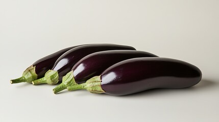 A neatly spaced row of fresh eggplant isolated on a white surface, even tones and crisp details showcasing organic shapes 
