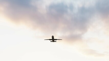 ULTRA HD. Airplane flies in blue sky. Travel. Airplane takes off against the background of sunset sky. 