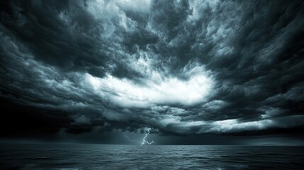 Fototapeta premium A stormy sky with dark clouds and lightning striking in the distance, creating a dramatic effect.