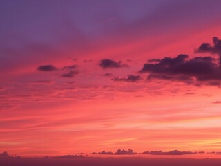 Obraz premium Colorful and vibrant abstract sky at sunset with swirling clouds and a gradient of orange, pink, and purple hues, purple, orange