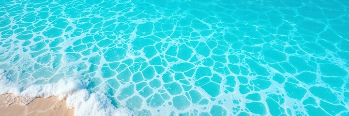 Obraz premium Crystal clear turquoise ocean water with white foamy waves crashing against the shore, creating a serene and refreshing texture underneath the sunny skies, texture, water