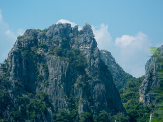 Landscape of limestone mountains covered with trees in Thailand.