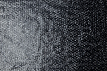 Bubble wrap texture isolated on black background.