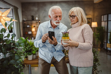 wife and husband explore about plant treatment on mobile phone