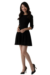 Fototapeta premium A smiling Asian woman in a black dress and heels poses against a plain white background.