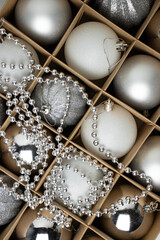 Box with Christmas baubles close-up. Home decoration for the new year. Home decor, copy space. Greeting card