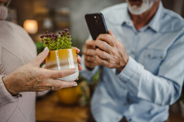 wife and husband explore about plant treatment on mobile phone