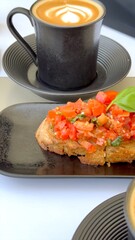 Bruschetta with vibrant toppings served with coffee celebrates Mediterranean culinary heritage and eco-conscious values rooted in fresh, seasonal ingredients. Bruschetta coffee tradition.
