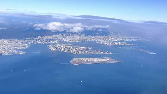 Aerial view of the Kansai International Airport (KIX) with izumisano city in background.