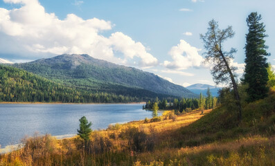 Picturesque landscape with Lake Yazevoe or Karakol in Katon - Karagay Park Altai sunny autumn in Kazakhstan