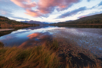 Sunset landscape with reflection with Lake Yazevoe or Karakol in Katon - Karagai park Altai mountain autumn in Kazakhstan