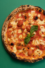 Italian pizza with basil and rosemary