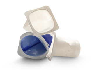 Empty crushed plastic yogurt pots