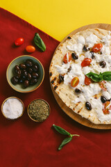 White Pizza (Pizza Bianca) with Cherry Tomatoes and Olives.