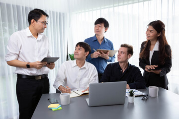 Group of diverse office worker employee working together on strategic business marketing planning in corporate office room. Positive teamwork in business workplace concept. Prudent