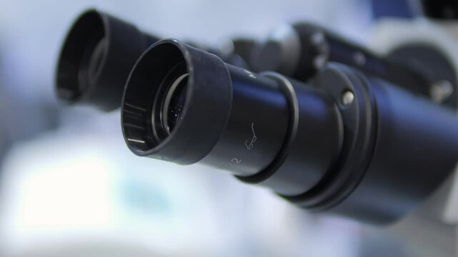 A Detailed CloseUp View of a Laboratory Microscope, Showcasing Its Features and Functionality