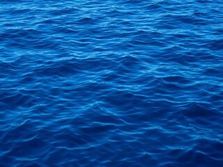 Obraz premium Rippling deep blue sea with mesmerizing texture resembling waves and ripples, calm, beauty, tranquil