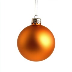 Orange Christmas ornament hangs on a thread, against an isolated white background