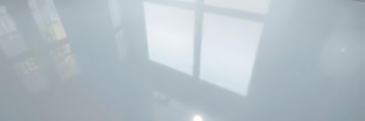 Close-up of a perfectly smooth, high-gloss surface reflecting light, abstract, high-resolution