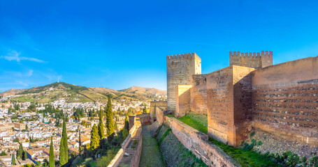 Fototapeta premium View of the Alcazaba fortress ruins of with the Albaicin neighborhood of Granada in the background, the Alhambra, Granada, Andalusia, Spain