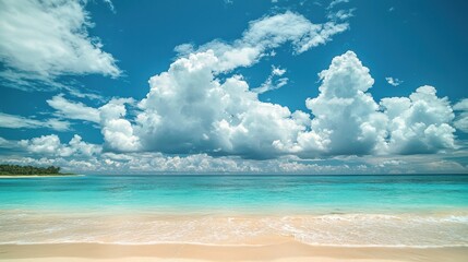 Obraz premium Tranquil beach scene with fluffy clouds tropical paradise nature bright afternoon serene viewpoint coastal landscape
