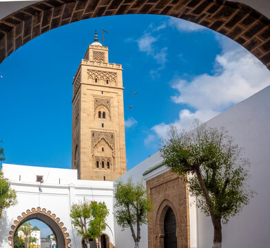 A minaret framed by a narrow alley arch in the traditional and elegant Habous quarter (New Medina) neighborhood of Casablanca, Morocco