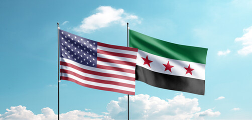 The new Syrian flag and United States oF America (USA) flag are waving in the sky