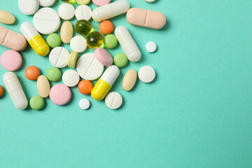 Various pills on color background