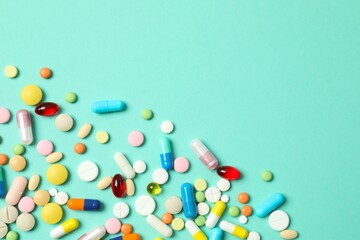 Various pills on color background