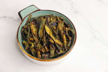 Bhindi Masala, stir-fried okra with Indian spices. Ladyfinger fry. Copy space. Bhendi ki sabzi.