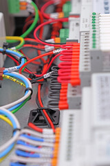 Automation modules controlled via a digital data bus. It is installed in an electric switchboard. Soft focus.