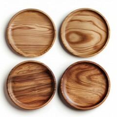 Four empty round wooden plates with unique wood grain patterns are lying on a white background, showcasing the natural beauty of the wood